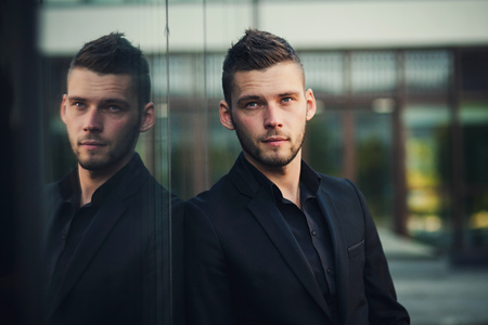 Portrait of a successful young businessman outdoorの写真素材
