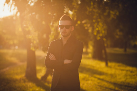 Portrait of a young successful man in the summer parkの写真素材