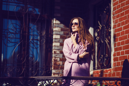 Fashion woman portrait of pretty trendy woman posing at the city in Europe, summer street fashion.の写真素材