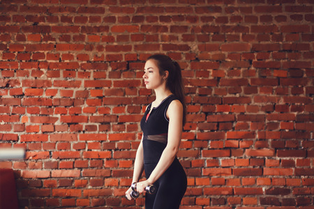 Beautiful sport woman working out in gymの写真素材