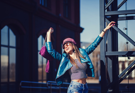 fashion model in sunglasses, leather jacket. stylish pretty brunette woman in city casual outfit,の写真素材