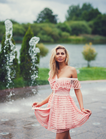 Fashionable female model in dress. Fashion young beautiful european girl posing outdoor.の写真素材