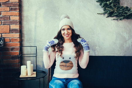 Happy woman smiling at home in Christmas day. Holidays New Yearの写真素材