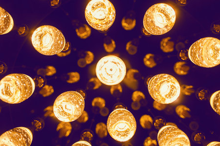 many vintage bright lamps on a dark backgroundの写真素材