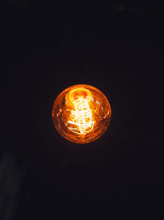 Light bulb on black background
