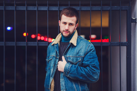 Young fashionable man standing outdoors.