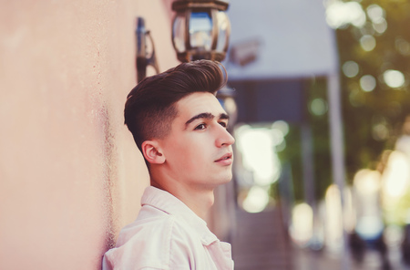 Close-up portait handsome young man in urban styleの写真素材
