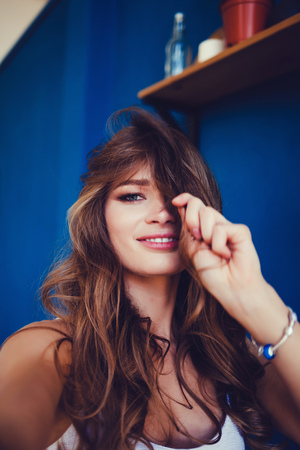 Young attractive woman taking selfie at homeの写真素材