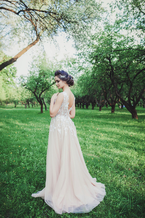 Beauty portrait of bride wearing fashion wedding dress with with luxury make-up and hairstyle.の写真素材