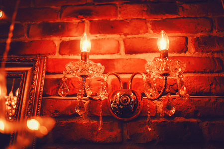 Vintage pendant light on brick backgroundの写真素材