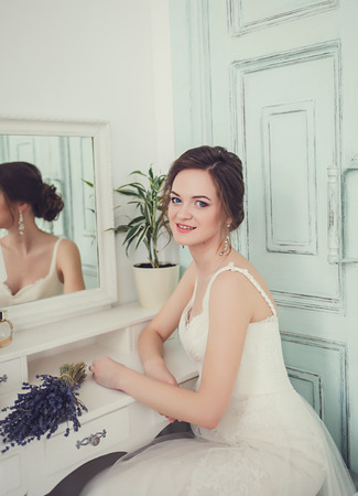 portrait of happy smiling bride in wedding dressの写真素材