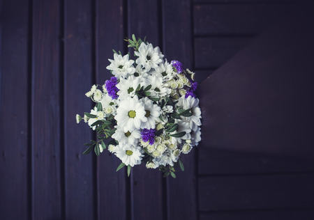 beautiful wedding bouquet on wooden background. the view from the topの写真素材