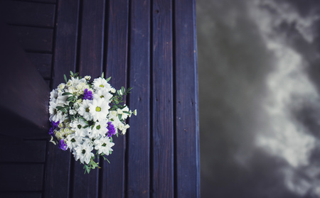beautiful modern wedding bouquet on wooden backgroundの写真素材