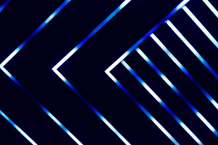 Neon glowing lines blue on dark backgroundの写真素材