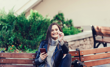 handsome caucasian brunette woman listening music with headphones, music, technology, relaxing conceptの写真素材