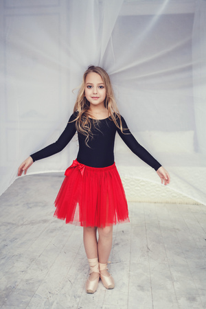 Little girl ballerina in pointe and red skirtの写真素材