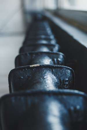 Row of black metal rough tubesの写真素材