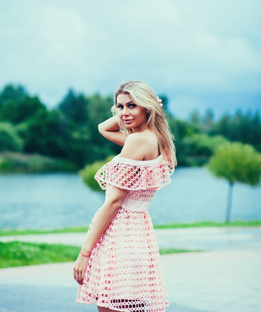 Portrait of a beautiful young woman. The model wears a summer dress.の写真素材