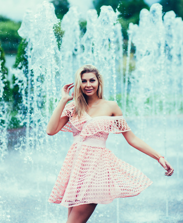 Young beautiful girl posing in a summer dressの写真素材