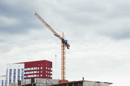 Crane and construction site of the building. new quarter