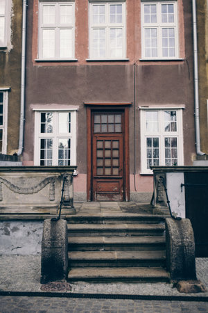 The front of an ornate building in neighborhood of  Poland, Gdansk 