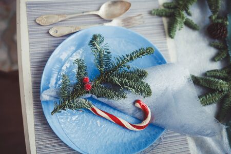 Christmas table setting with vintage dishware. Top view.の写真素材