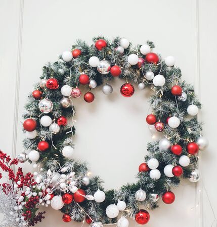 Christmas wreath with balls on the wall in the living room. new year conceptの写真素材