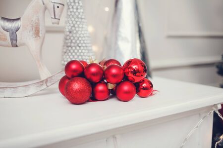 red Christmas balls are on the shelfの写真素材