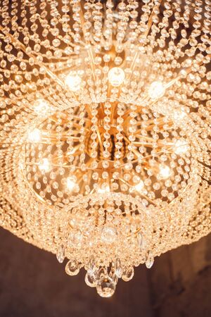 hanging bright chandelier with crystalsの写真素材