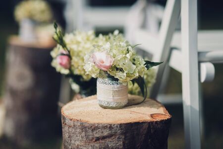 wedding decoration-fresh flowers in a vase with waterの写真素材