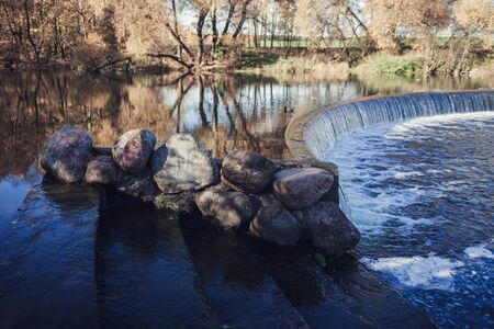 Autumn Park - a small waterfall in the National forestの写真素材