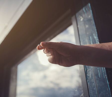 the man holds out his hand with the ring. offer hands and heartsの写真素材