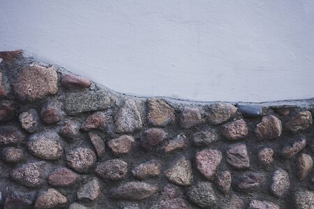 stone wall of an old antique houseの写真素材