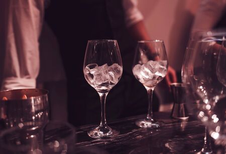 two empty glasses of ice on the barの写真素材