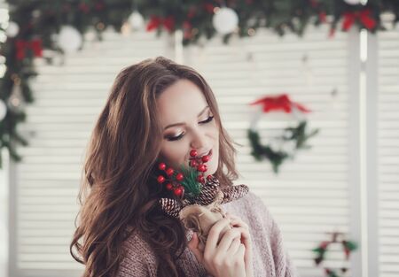 charming girl with make-up in a sweater in a new year imageの写真素材