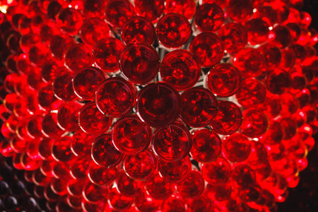many red bottoms of wine bottles in the interior of the restaurantの写真素材