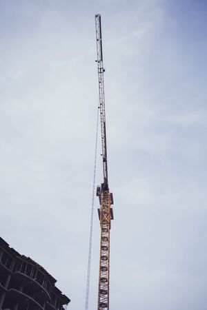 tower crane on the construction of a new houseの写真素材
