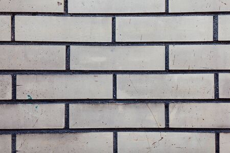 Gray wall background. Old grungy brick wall horizontal texture.の写真素材