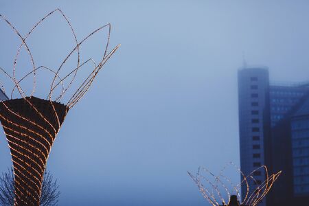 Christmas illumination on the background of a foggy cityの写真素材