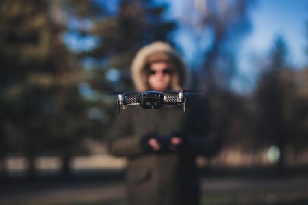 blurred man on the background of a flying drone.の写真素材