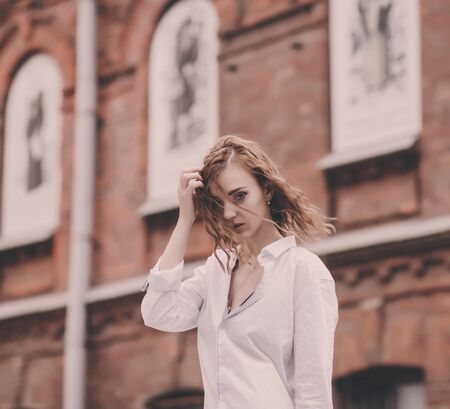 lifestyle portrait curly woman in stylish casual clothingの写真素材
