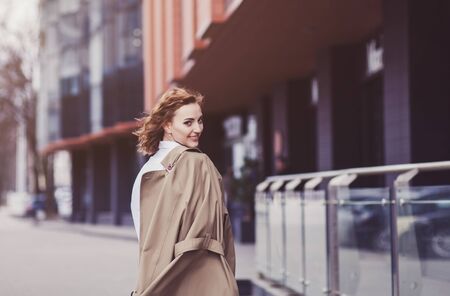 Beautiful fashion model in autumn clothes outdoors. Lady in elegant coat.の写真素材