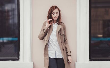 Attractive woman in spring outfit posing outsideの写真素材
