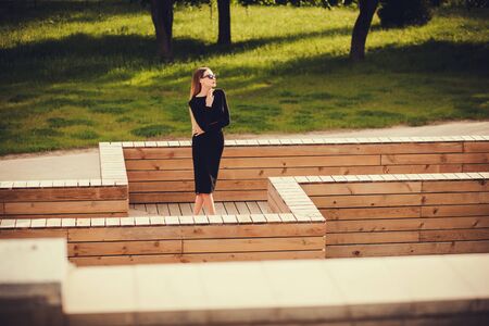 beautiful girl in sunglasses posing in the city. copy spaceの写真素材