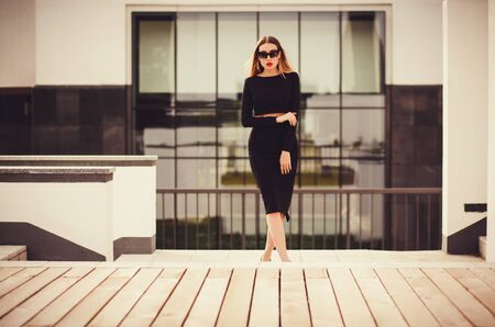 portrait model in sunglasses near the hotelの写真素材