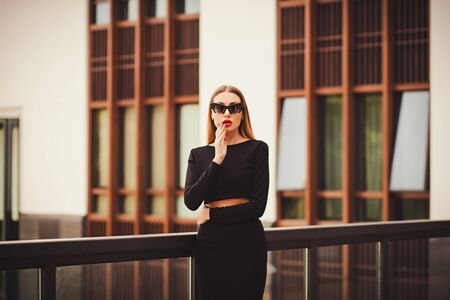 Beautiful young business woman long hair wearing dress business clothes for meetings. Collection perfect body shape glasses hotelの写真素材