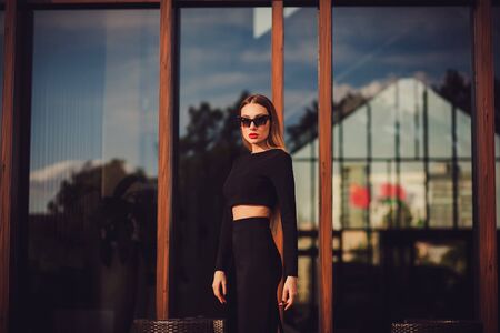 Beautiful young business woman long hair wearing dress suit top skirt. business clothes for meetings walks summer fall collection perfect body shape glasses hotelの写真素材