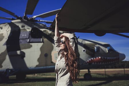 Fashion brunette model girl wearing military style and sunglasses.の写真素材