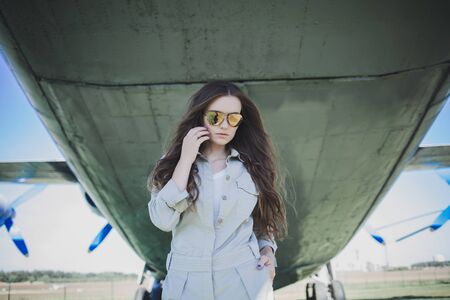 Outdoor fashion photo of young beautiful woman in sunglassesの写真素材