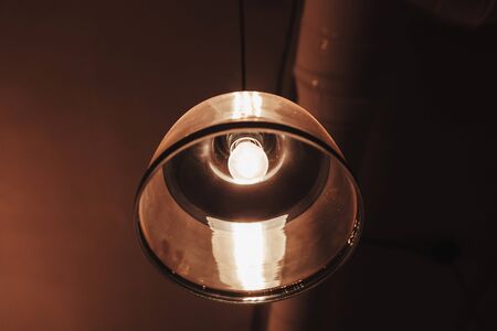 Close up vintage lamp in cafe at night for backgroundの写真素材